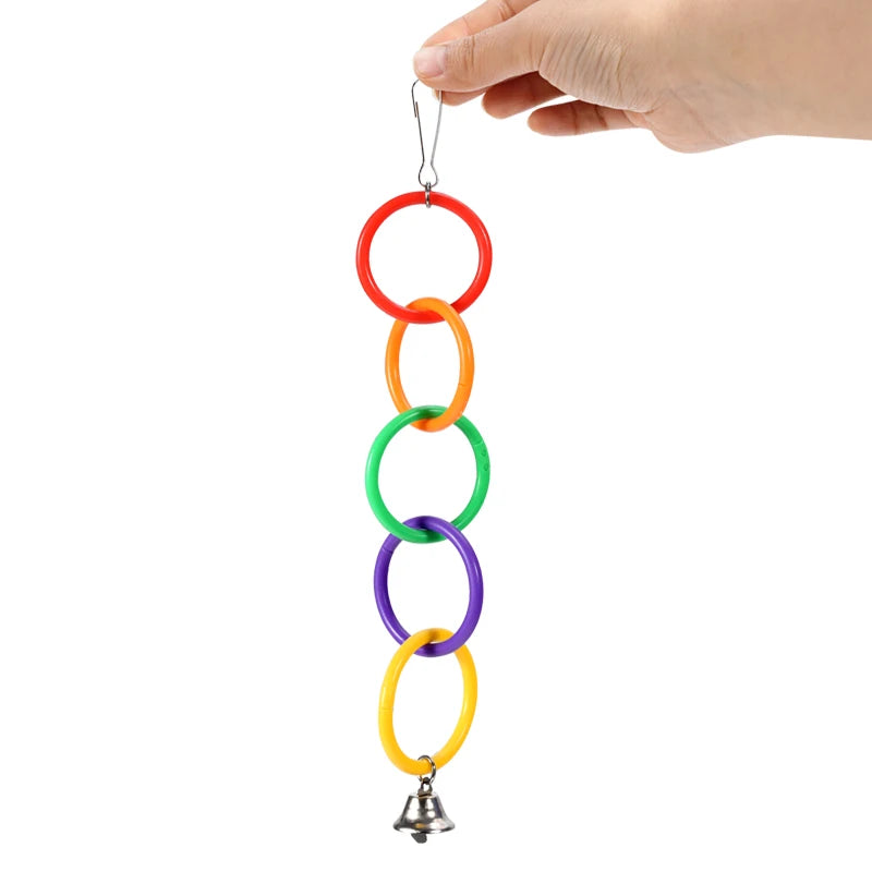 Juguete para pájaros con campana y anillo trepador colorido